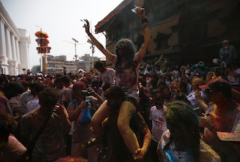 People gather to celebrate Holi in