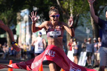Jun 26, 2021; Eugene, OR, USA; Robyn Stevens celebrates after crossing the finish line of the women's 20K race walk during the US Olympic Team Trials at Hayward Field. Mandatory Credit: Kirby Lee-USA TODAY Sports