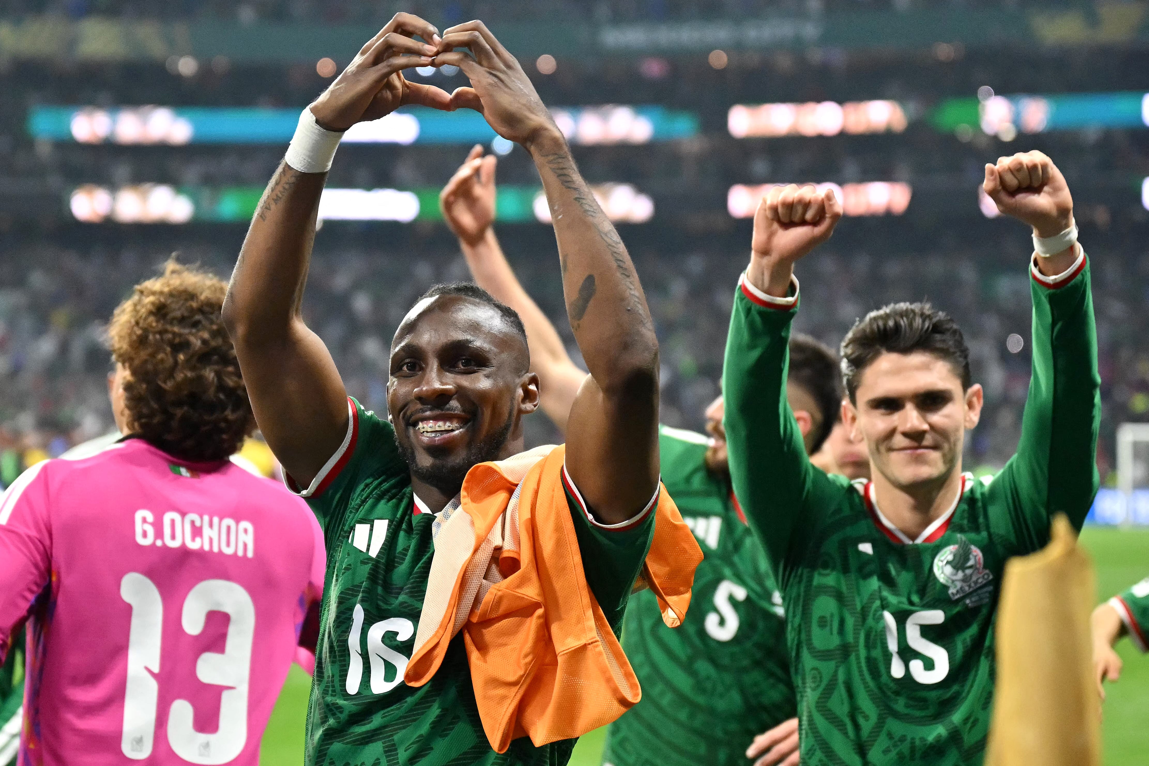 Mexico's forward #16 Julian Quinones and Mexico's defender #15 Israel Reyes celebrate after winning the 2026 World Cup round of 32 football match between Mexico and Ecuador at the Mexico City Stadium in Mexico City on June 30, 2026. (Photo by CARL DE SOUZA / AFP)