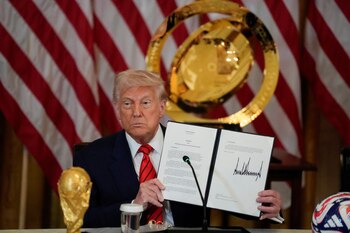 U.S. President Donald Trump holds