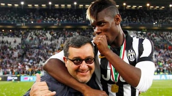 Mino Raiola junto a Paul