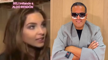 Una mujer de pelo castaño en primer plano parcial y un hombre con gafas de sol oscuras decoradas con perlas, chaqueta a cuadros y brazos cruzados.
