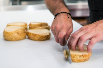 Chef Frederick Schoen-Kiewert cuts potatoes