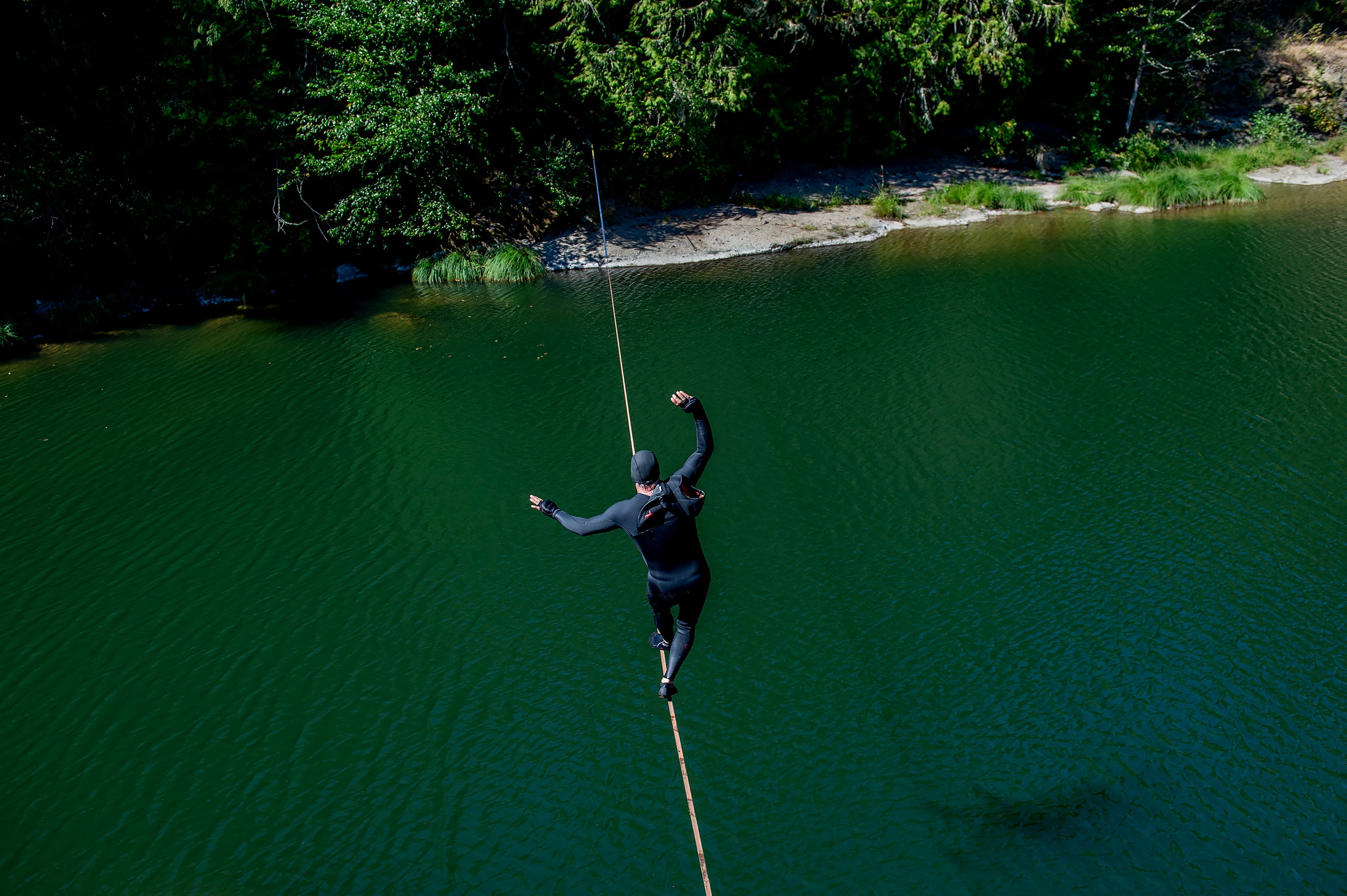 Adam Grosowsky slack-lines across the Row River, near his home in Eugene, Ore., on Friday, Aug. 28, 2026. As the body ages, those systems can weaken. But there are exercises and habits that can help Ñ and it turns out that balance junkies like Grosowsky have a lot to teach the rest of us about how to age well. (Amanda Lucier/The New York Times)