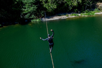 Adam Grosowsky slack-lines across the Row River, near his home in Eugene, Ore., on Friday, Aug. 28, 2026. As the body ages, those systems can weaken. But there are exercises and habits that can help Ñ and it turns out that balance junkies like Grosowsky have a lot to teach the rest of us about how to age well. (Amanda Lucier/The New York Times)