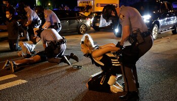 People are detained during protests