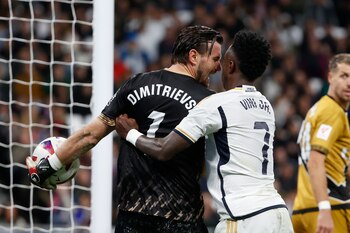 Dimitrievski y Vinicius (EFE/Juan Carlos