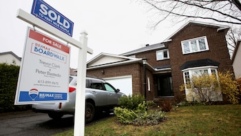 FILE PHOTO: Houses are seen for sale and under construction in a neighbourhood of Ottawa