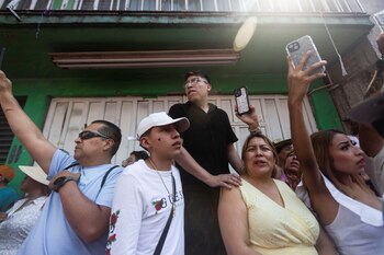 People watch the re-enactment of