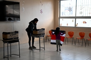 A woman votes at a