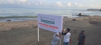 La Alcaldía de Puerto Colombia prohibió el ingreso de bañistas frente al Muelle 1888 y destinó el sector a la contemplación de atardeceres - crédito Alcaldía