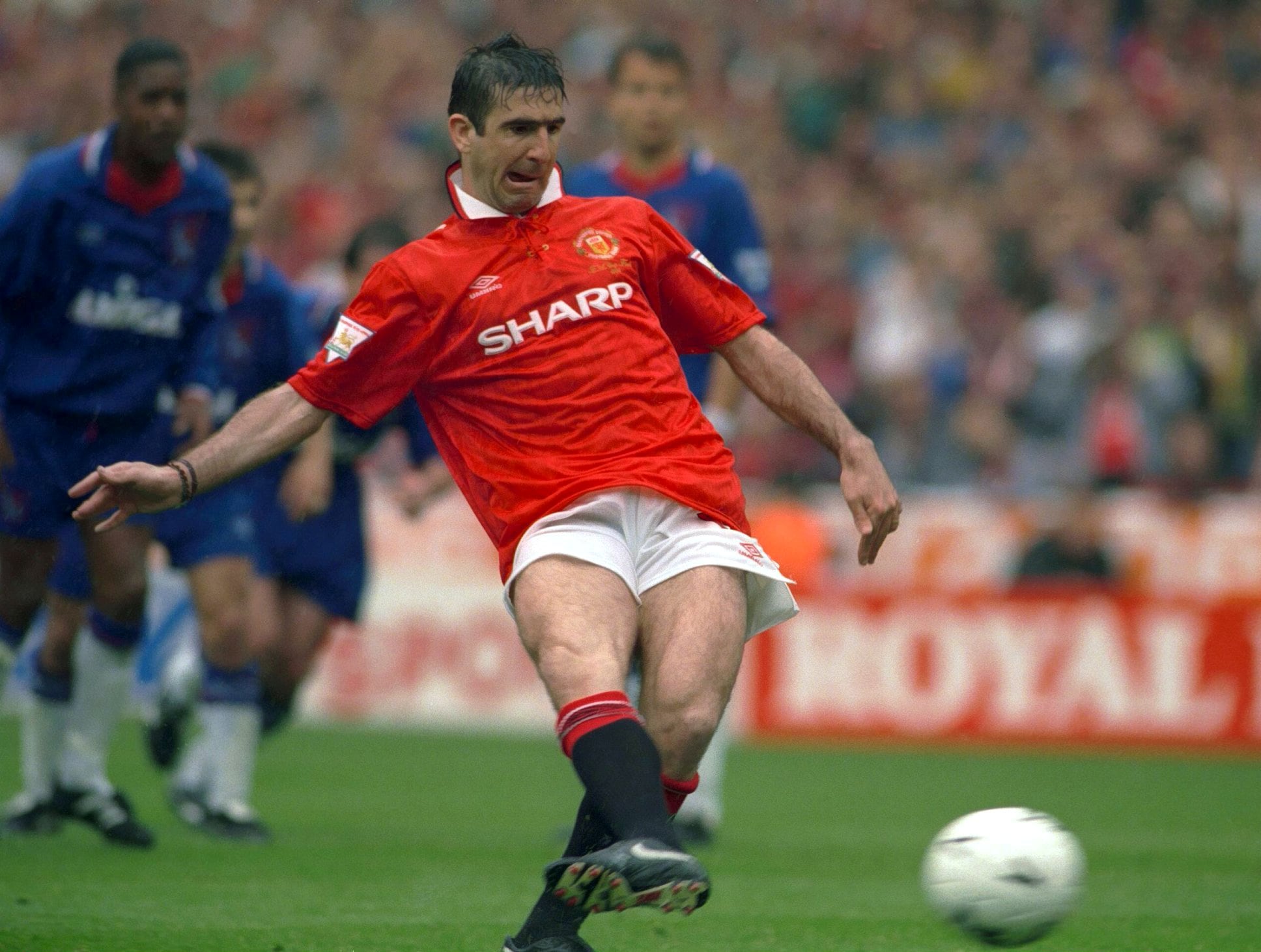 FILE PHOTO: ON THIS DAY -- May 14 May 14, 1994 SOCCER - Manchester United forward Eric Cantona scores from the penalty spot en route to a 4-0 victory against Chelsea in the FA Cup final at Wembley Stadium, London. Man United had already won the Premier League title and Cantona's brace followed by goals from Mark Hughes and Brian McClair ensured they became the fourth team in the 20th century to complete the domestic double. Cantona won nine trophies in his five-year spell with Man United and retired at the end of the 1996-97 season. Action Images via REUTERS/File photo