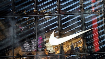 FILE PHOTO: People visit the Nike store at 5th Avenue during the holiday season in New York