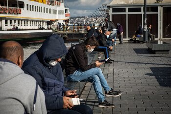 People browse smartphones at the