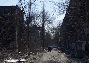 Local residents walk near residential