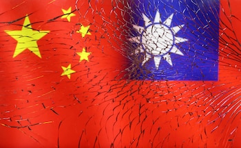 FILE PHOTO: Chinese and Taiwanese flags are seen through broken glass in this illustration taken, April 11, 2023. REUTERS/Dado Ruvic/Illustration/ File Photo/File Photo