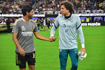 Aug 3, 2022; Los Angeles, California, US; LAFC forward Carlos Vela (10) meets with Club America goalkeeper Guillermo Ochoa (13) before the match at SoFi Stadium. Mandatory Credit: Gary A. Vasquez-USA TODAY Sports