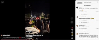 Un fotograma de un video nocturno registra al cantante Robbie Williams conversando con un seguidor en la vía pública