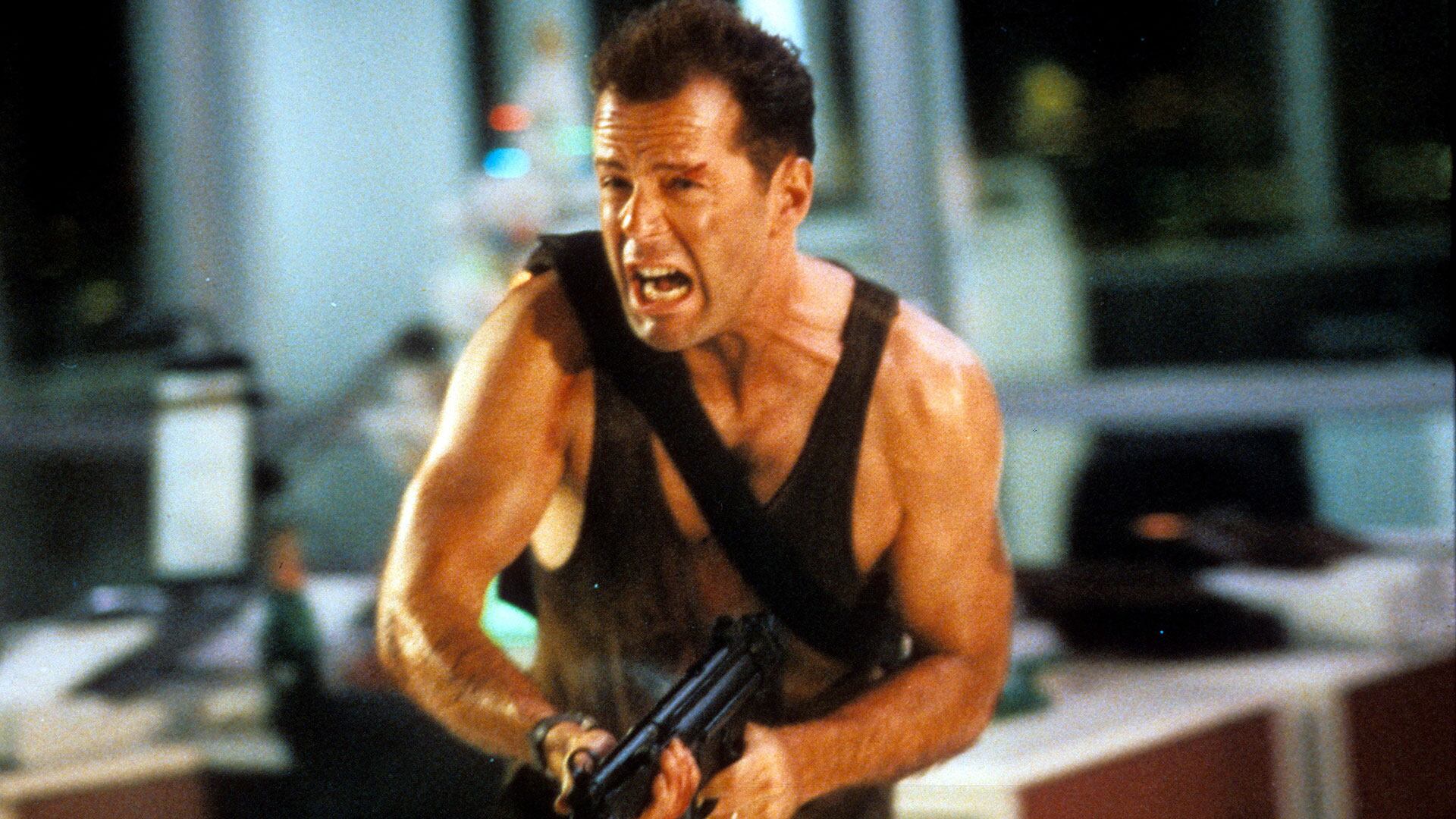 Bruce Willis running with automatic weapon in a scene from the film 'Die Hard', 1988. (Photo by 20th Century-Fox/Getty Images)