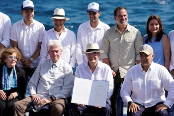 Bill Clinton y Guillermo Lasso