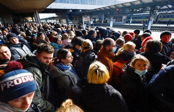 People wait to board a