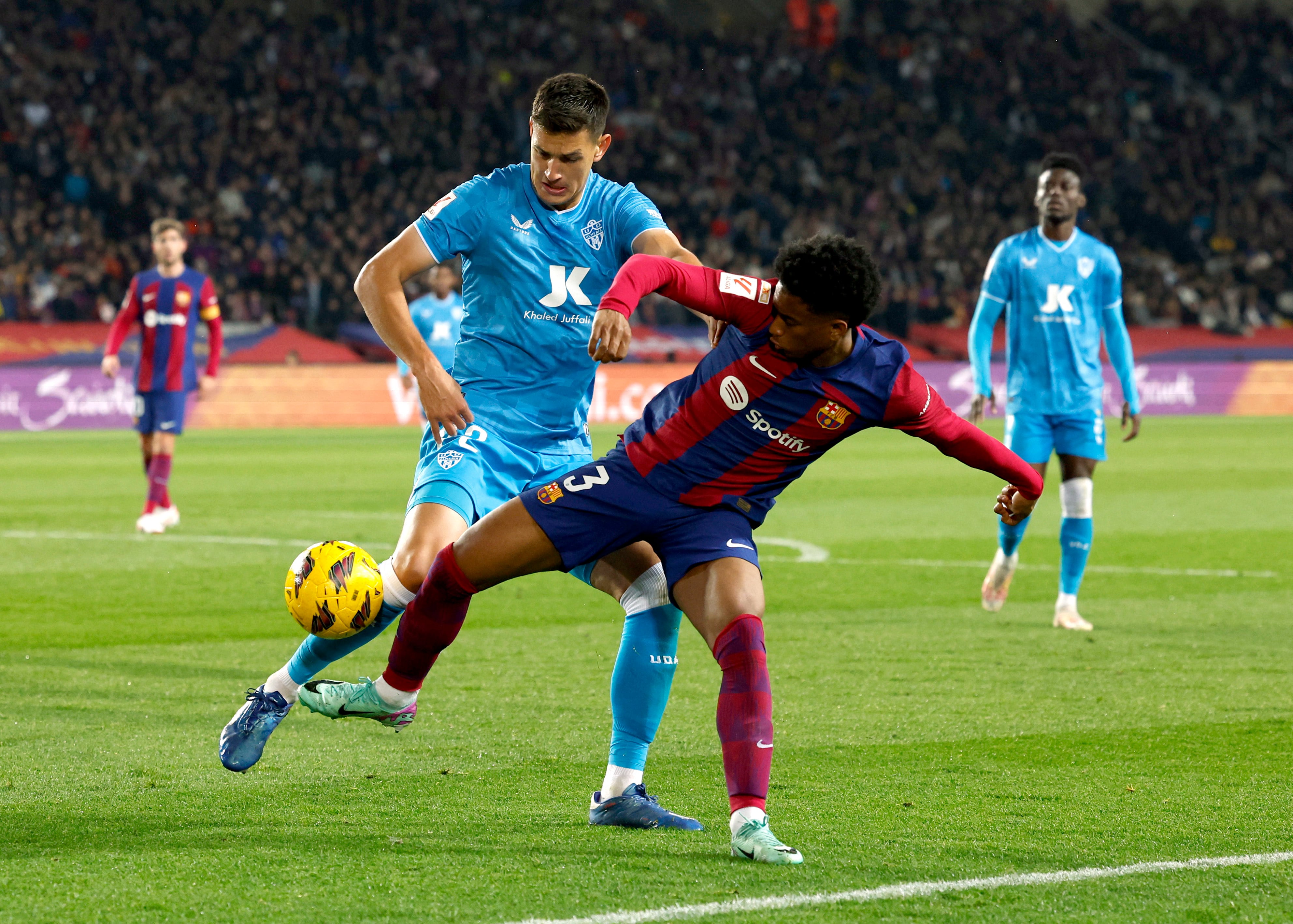 Soccer Football - LaLiga - FC Barcelona v Almeria - Estadi Olimpic Lluis Companys, Barcelona, Spain - December 20, 2023 FC Barcelona's Alejandro Balde in action with Almeria's Cesar Montes REUTERS/Albert Gea