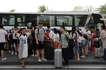 Turistas en Sanya, en la