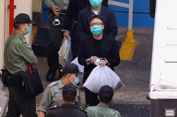 Pro-democracy activist Tam Tak-chi walks to a prison van to head to court, over national security law charges, in Hong Kong, China March 2, 2021. Picture taken March 2, 2021. REUTERS/Tyrone Siu