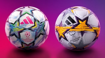 Dos balones de fútbol de la marca Adidas con logos de la UEFA Champions League sobre un fondo de color violeta y rosado.