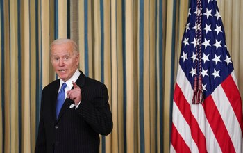 U.S. President Joe Biden answers a question after signing into law H.R. 3076, the "Postal Service Reform Act of 2022" at the White House in Washington, U.S., April 6, 2022. REUTERS/Kevin Lamarque