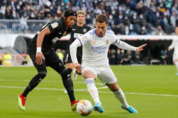Soccer Football - LaLiga - Real Madrid v Elche - Santiago Bernabeu, Madrid, Spain - January 23, 2022 Real Madrid's Eden Hazard in action with Elche's Johan Mojica REUTERS/Nacho Doce