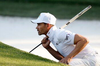Mar 13, 2025; Ponte Vedra Beach, Florida, USA; Camilo Villegas checks out the ninth green during the first round of The Players Championship golf tournament at TPC Sawgrass. Mandatory Credit: Jeff Swinger-Imagn Images