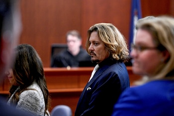 Actor Johnny Depp sits in