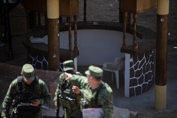 Soldiers leave a clandestine cockfighting