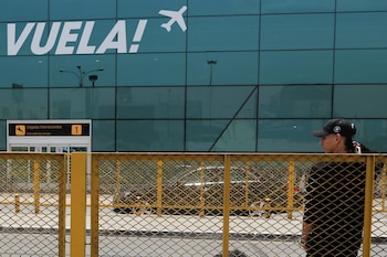 A passenger stands as the airport reopens following a LATAM Airlines jet colliding with a vehicle on the runway of Peru's Jorge Chavez International Airport, in Lima, Peru November 19, 2022. REUTERS/Sebastian Castaneda