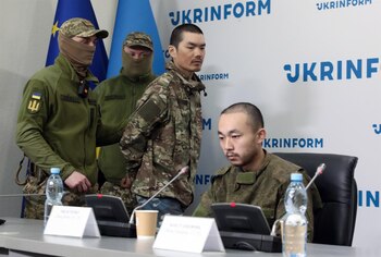 Los detenidos -Wang Guangjun y