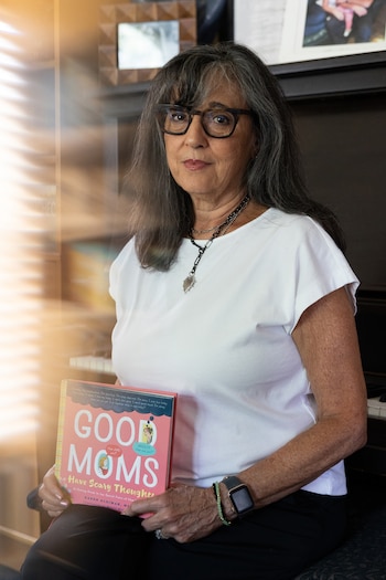 The author Karen Kleiman holds a copy of her book ÒGood Moms Have Scary Thoughts,Ó at home near Philadelphia, Sept. 1, 2026. Lindsay Clancy turned to the book for advice around two months before she killed her children. (Rachel Wisniewski/The New York Times)