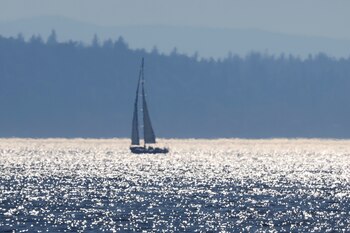A sailboat is seen off
