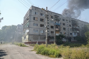 Smoke is billowing from a damaged building following a Russian strike on Kramatorsk, west of the Donbas region in Ukraine, on the morning of August 18, 2026.