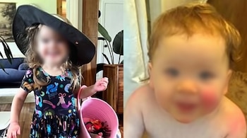Una niña con sombrero de ala ancha y cesta rosa junto a un bebé con piel enrojecida en la mejilla, ambos con el rostro difuminado.