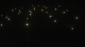 Imagen nocturna y aérea de