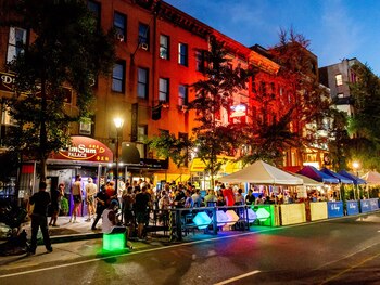 Crowds gather outside bars and