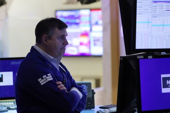 A trader works on the