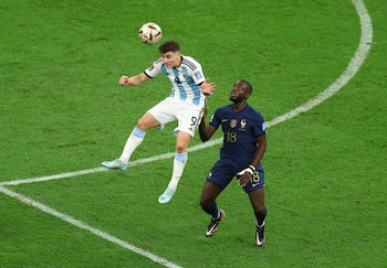 Soccer Football - FIFA World Cup Qatar 2022 - Final - Argentina v France - Lusail Stadium, Lusail, Qatar - December 18, 2022 Argentina's Julian Alvarez in action with France's Dayot Upamecano REUTERS/Molly Darlington