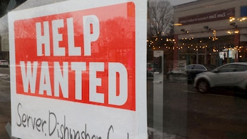 FILE PHOTO: A “Help Wanted” sign hangs in restaurant window in Medford