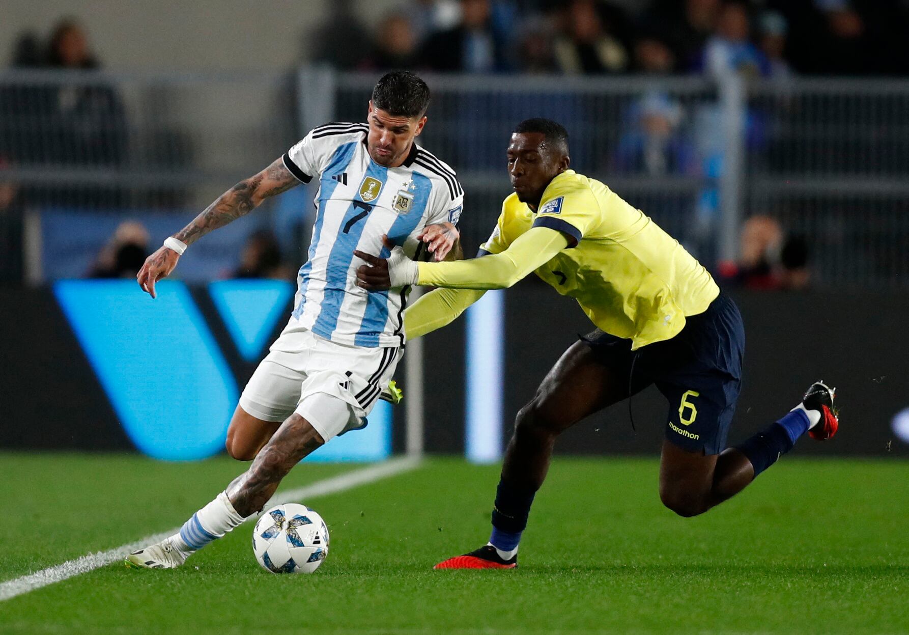 Soccer Football - World Cup - South American Qualifiers - Argentina v Ecuador - Estadio Mas Monumental, Buenos Aires, Argentina - September 7, 2023 Argentina's Rodrigo De Paul in action with Ecuador's William Pacho REUTERS/Agustin Marcarian