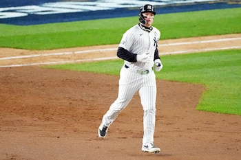Oct 28, 2024; New York, New York, USA; New York Yankees outfielder Alex Verdugo (24) hits a two run home run during the ninth inning against the Los Angeles Dodgers in game three of the 2024 MLB World Series at Yankee Stadium. Mandatory Credit: Robert Deutsch-Imagn Images