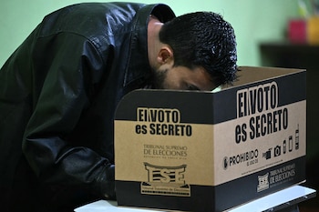 A man votes at a