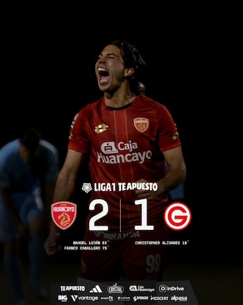 Un futbolista vestido con camiseta roja y negra grita de celebración en un campo oscuro, con el marcador "2-1" y logos de Sport Huancayo y "G" en primer plano
