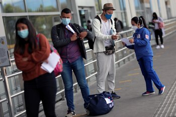 A Red Cross employee wearing